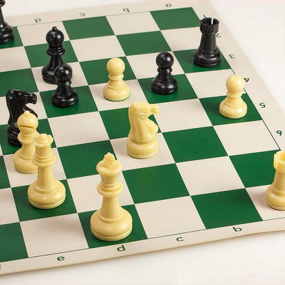 Small Wukusy plastic portable chess set with black and white chess pieces arranged on a playing surface.