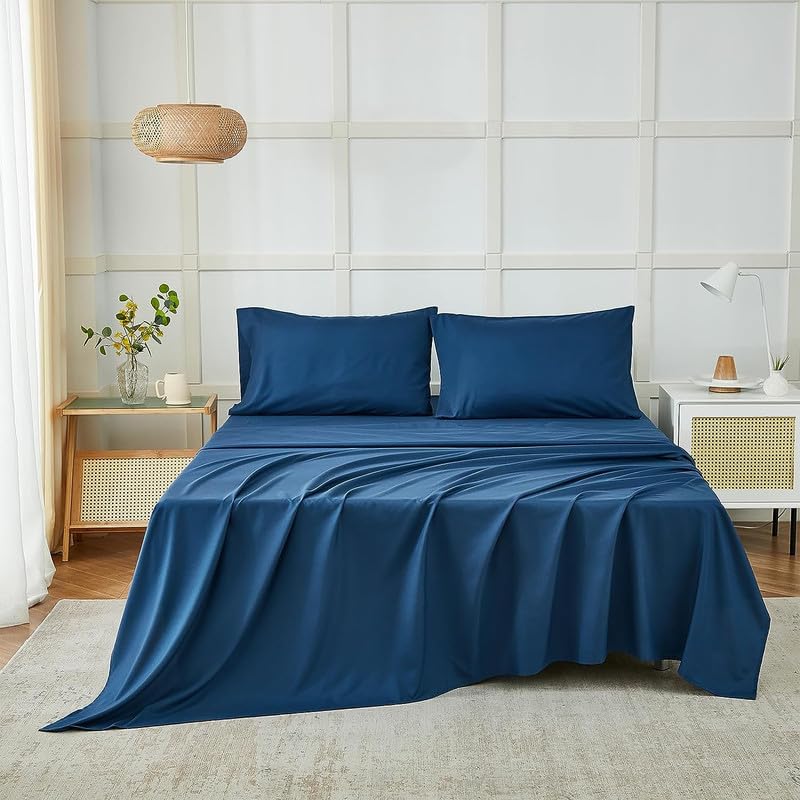 Navy blue double bedsheet with floral pattern from FIZZI SHOP, 90x100 inches, neatly spread on a double bed.