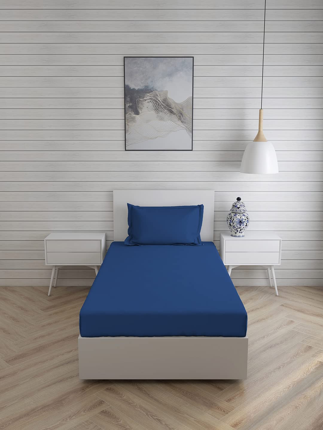 Royal blue FIZZI SHOP single bedsheet with matching pillow cover, featuring a soft, smooth fabric for comfortable sleep.