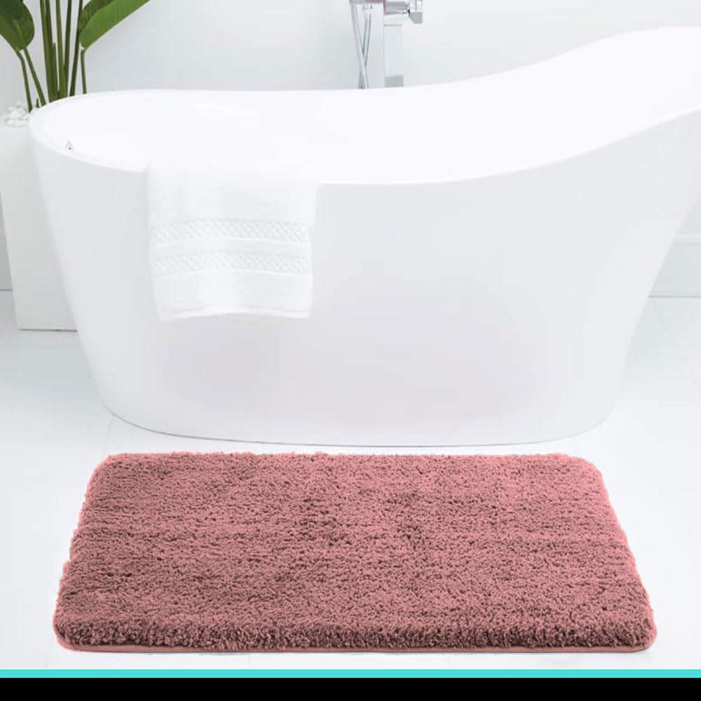Pink Seasons bath mat for bathroom, soft and absorbent, shown laid out on a bathroom floor.