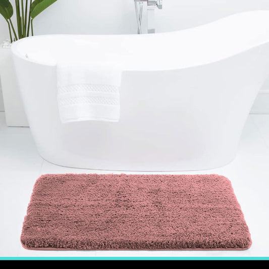 Pink Seasons bath mat for bathroom, soft and absorbent, shown laid out on a bathroom floor.