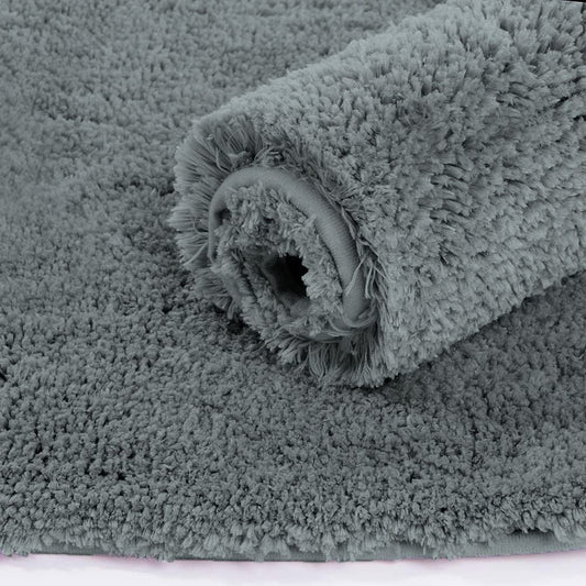 Grey Seasons bath mat for bathroom or door, soft and absorbent, shown laid out on a bathroom floor.