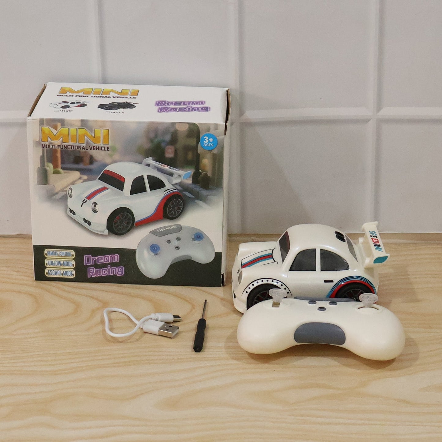 Wukusy mini RC racing car toy with remote control and rechargeable battery, suitable for kids, shown on a plain background.