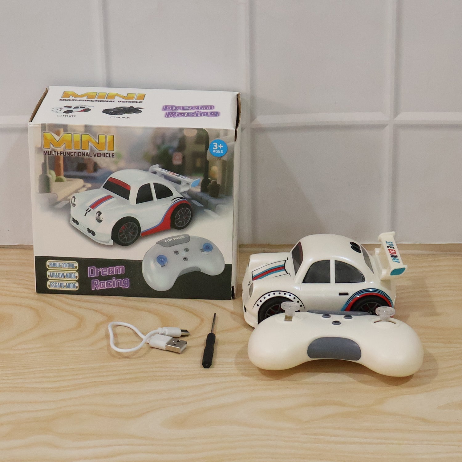 Wukusy mini RC racing car toy with remote control and rechargeable battery, suitable for kids, shown on a plain background.