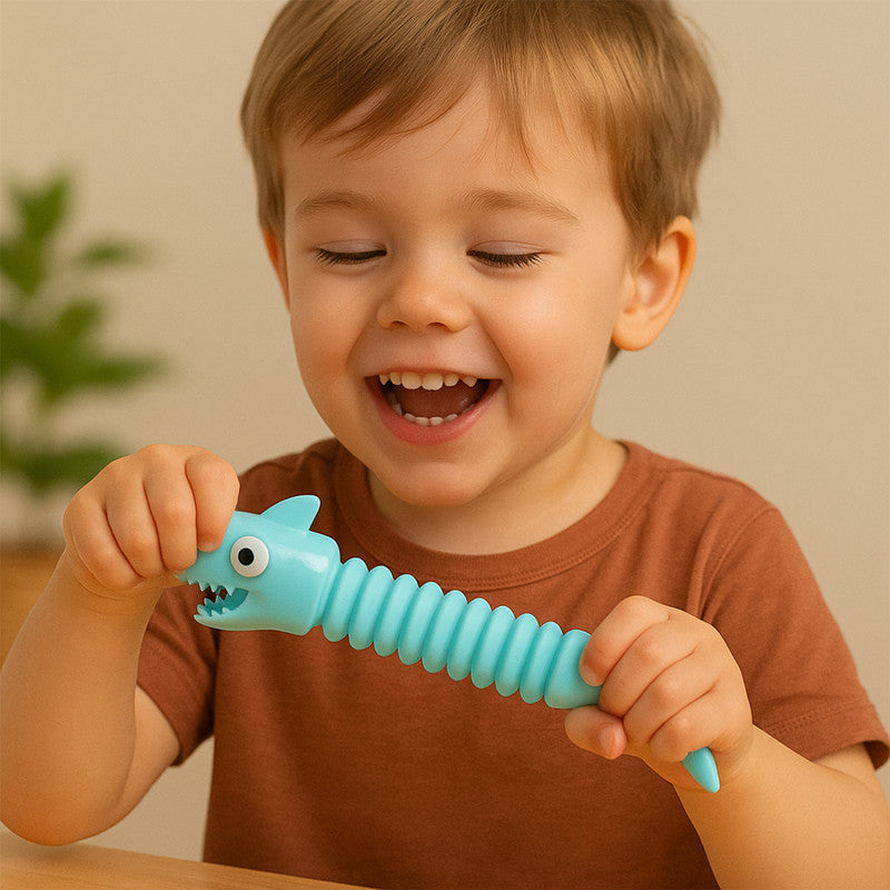 Colorful shark-shaped magic spring toy by Wukusy, featuring a coiled spring design perfect for fun and stress relief.