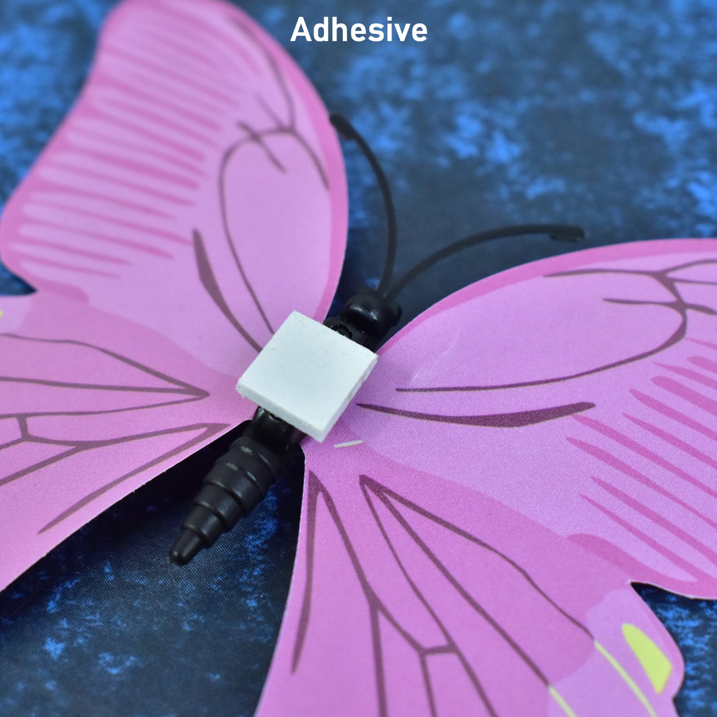 Colorful butterfly wall stickers in a 12-piece set, decorative home decor by Wukusy featuring vibrant butterfly designs on a wall.