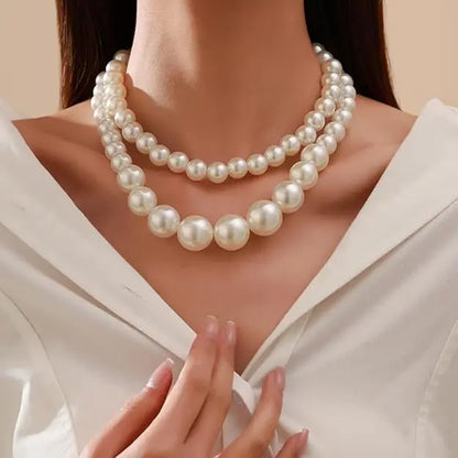 Two-layer artificial pearl mala jewelry set with matching earrings, featuring elegant imitation jewelry design.