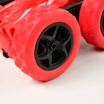 Wukusy double-sided remote control stunt car performing a flip, showcasing fast movement and vibrant design in action.