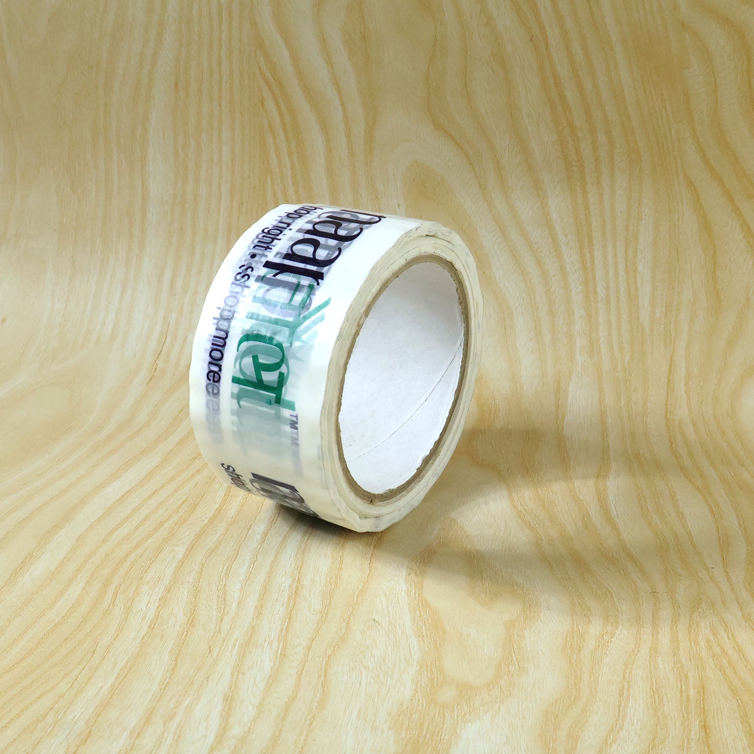 Wukusy Naaptol printed heavy-duty packaging tape with bold design, 100x50mm, shown in close-up image.