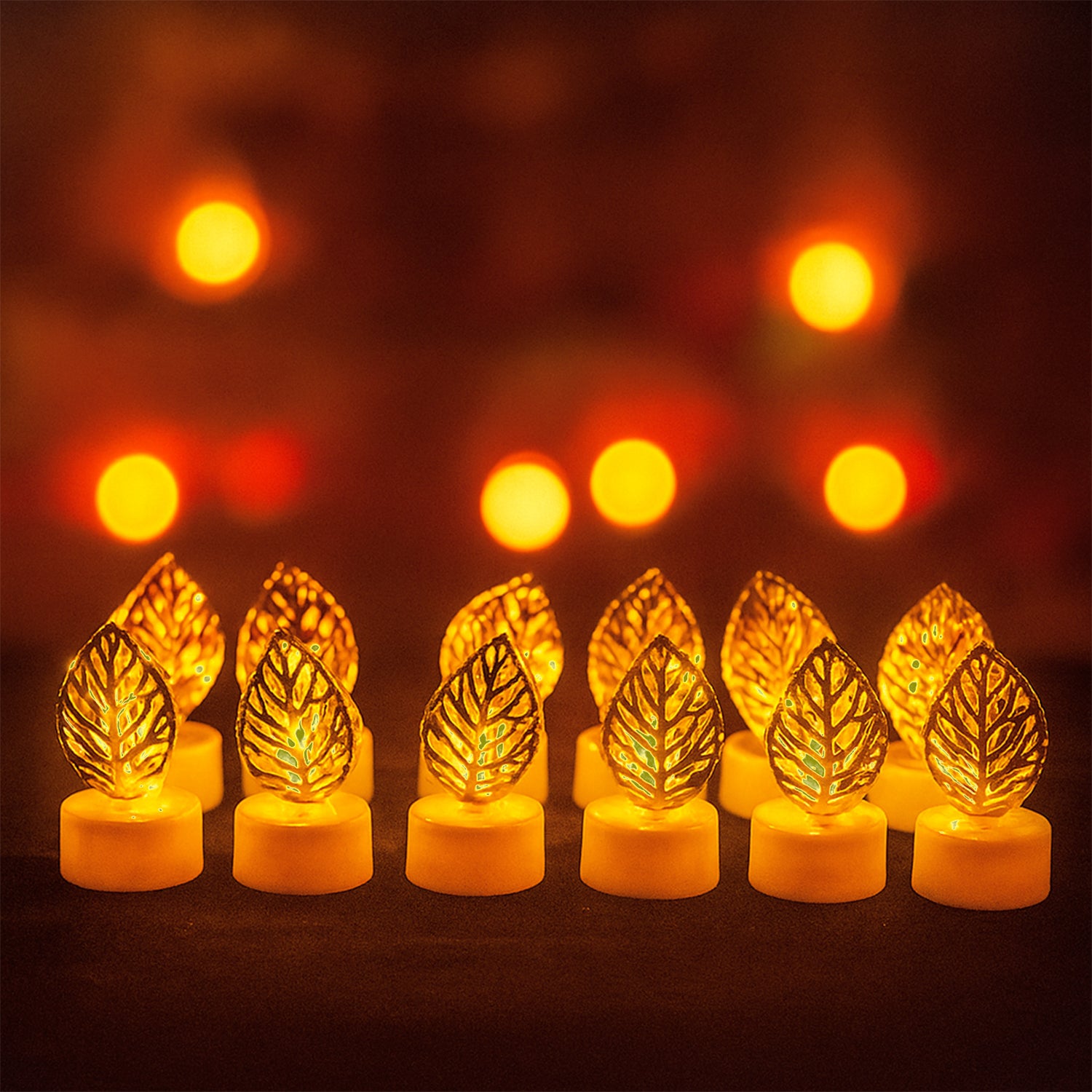 Set of 12 Wukusy decorative golden leaf shaped flameless LED candles for elegant home decor.