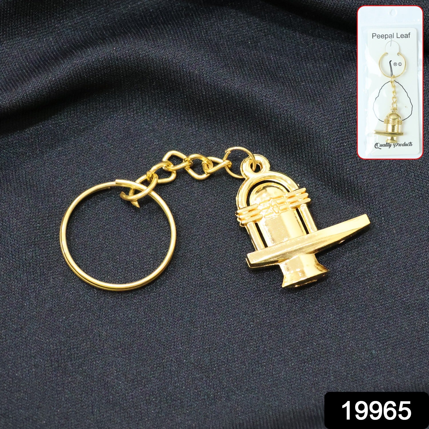 Golden metal Shivling keychain from Wukusy, featuring detailed Shivling design, attached to a keyring for everyday use.