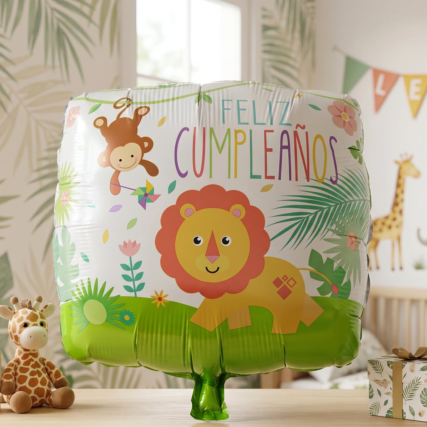 Gold lion foil balloon with jungle theme and birthday design, featuring vibrant jungle foliage and playful lion illustration.