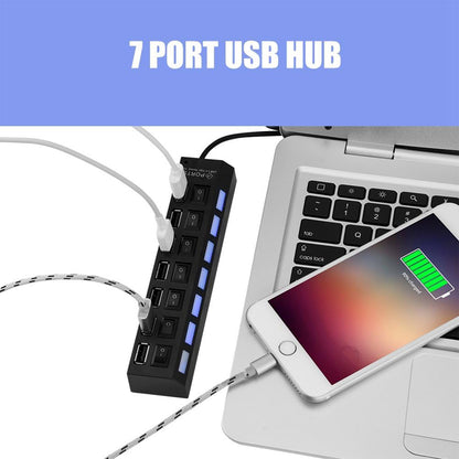 Wukusy 7-port USB 2.0 splitter hub with independent on/off switches, LED indicators, connected to a PC with various USB devices