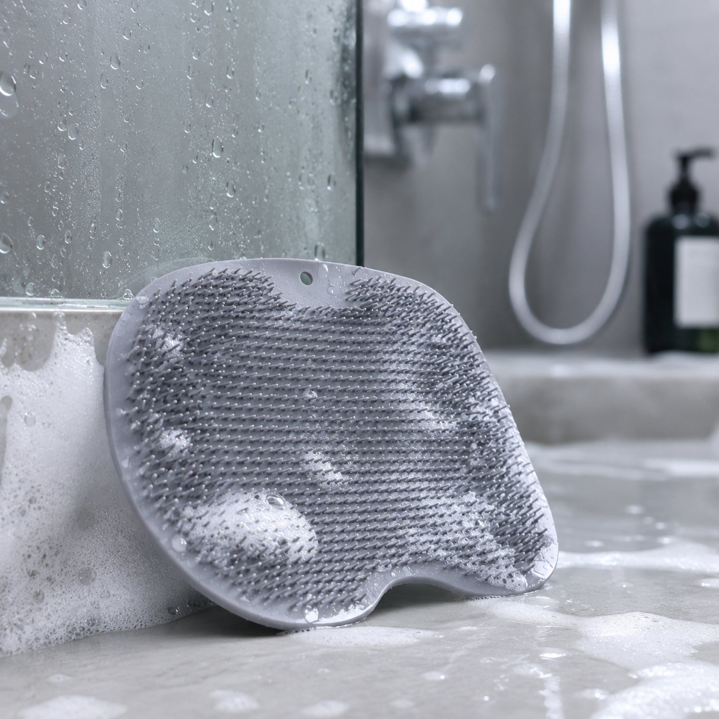 Wukusy silicone bathroom foot cleaning scrubber mat, 27x20 cm, with textured surface for foot scrubbing and hygiene.