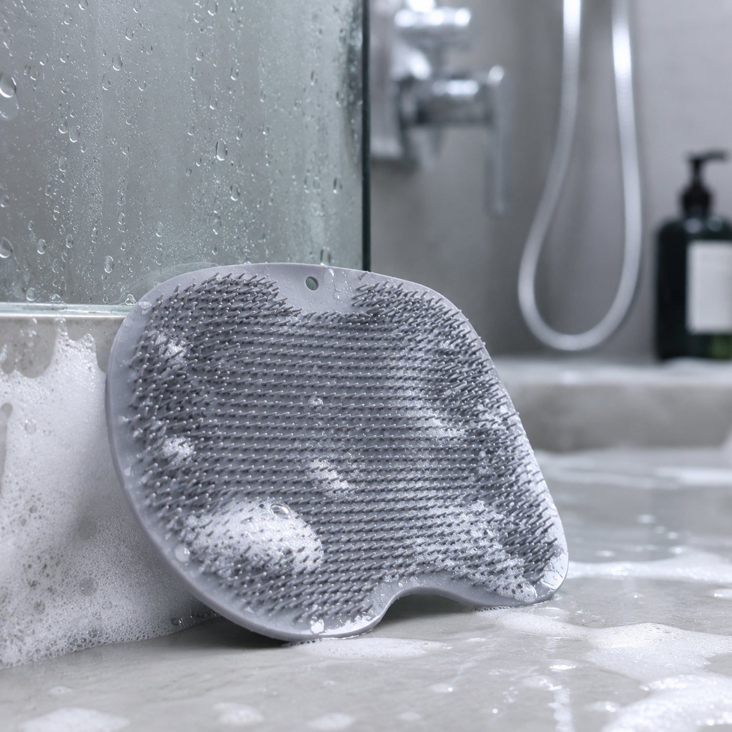 Wukusy silicone bathroom foot cleaning scrubber mat, 27x20 cm, with textured surface for foot scrubbing and hygiene.