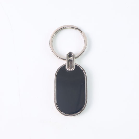 Elegant black and silver oval metal keychain by Wukusy, featuring a sleek design and durable metal construction.