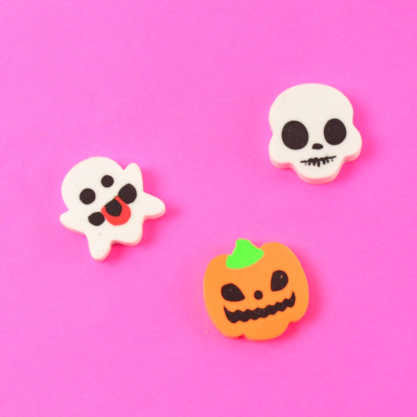 Set of 50 Wukusy cartoon shape rubber erasers in mixed colors and designs, ideal for office and school use.