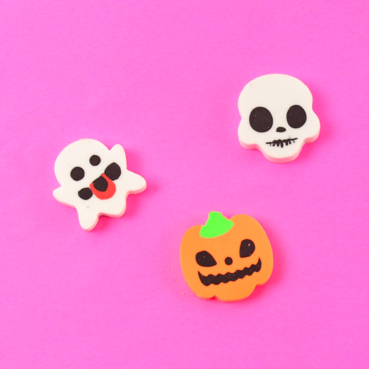Set of 50 Wukusy cartoon shape rubber erasers in mixed colors and designs, ideal for office and school use.