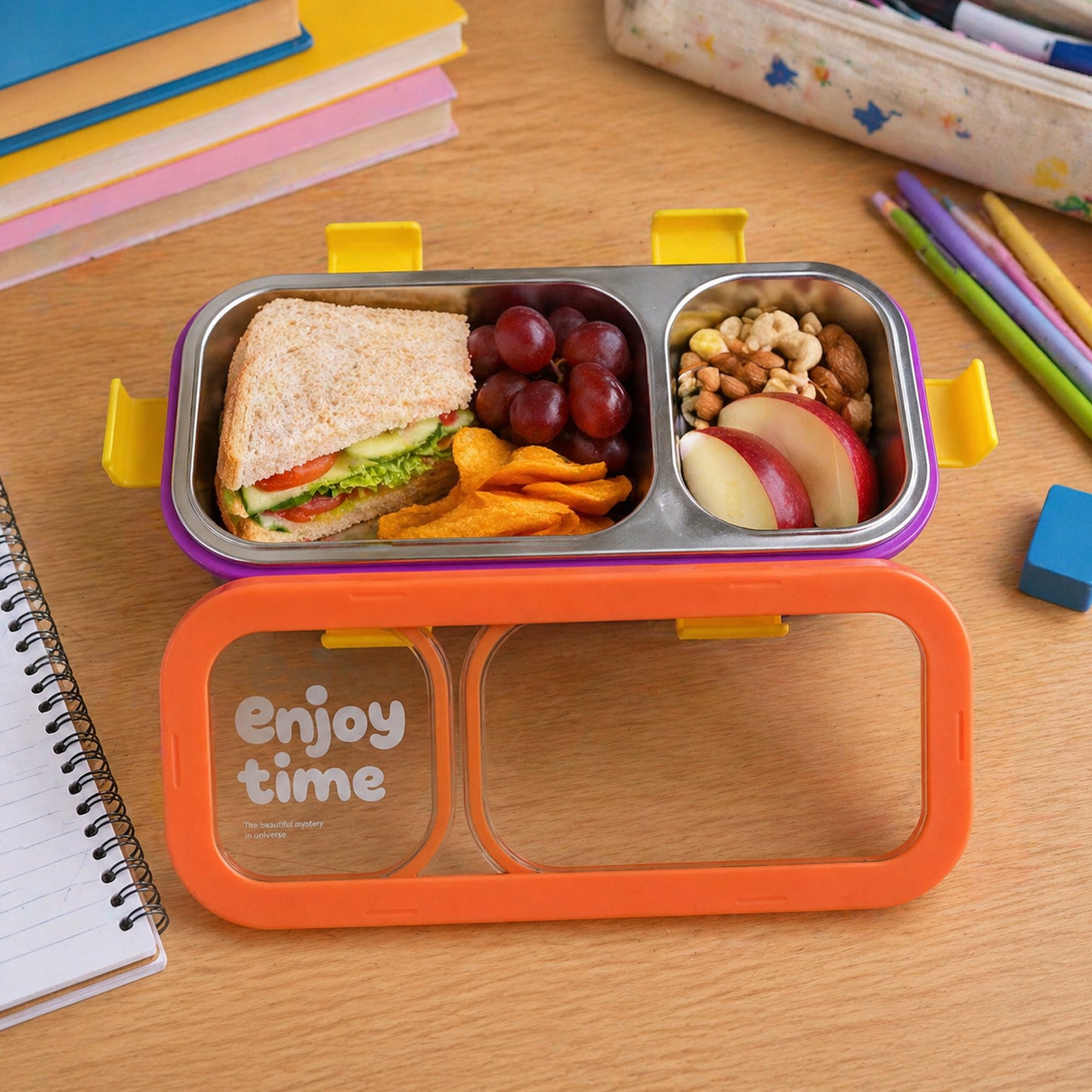 Wukusy stainless steel leak-proof lunch box with two compartments, spoon and fork, featuring a sleek, durable design.