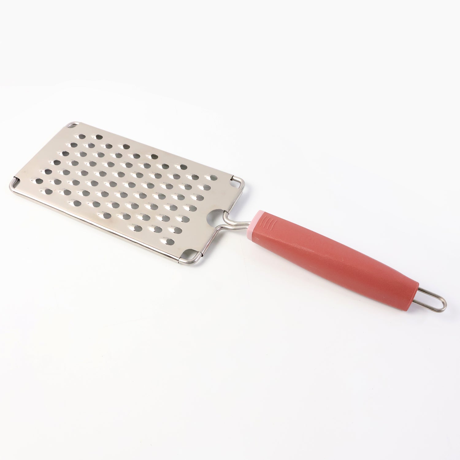 Wukusy Supermom stainless steel vegetable and cheese grater with soft grip handle for kitchen use, shown with grated vegetables and cheese.
