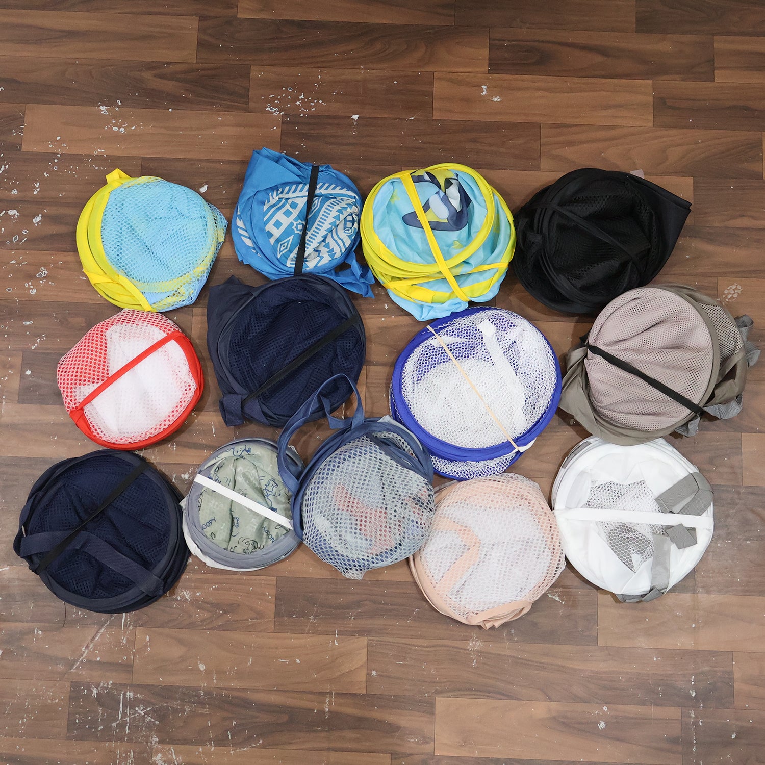 Foldable mesh laundry basket by Wukusy with mixed design, sturdy cloth storage bag for clothes organization and easy transport.