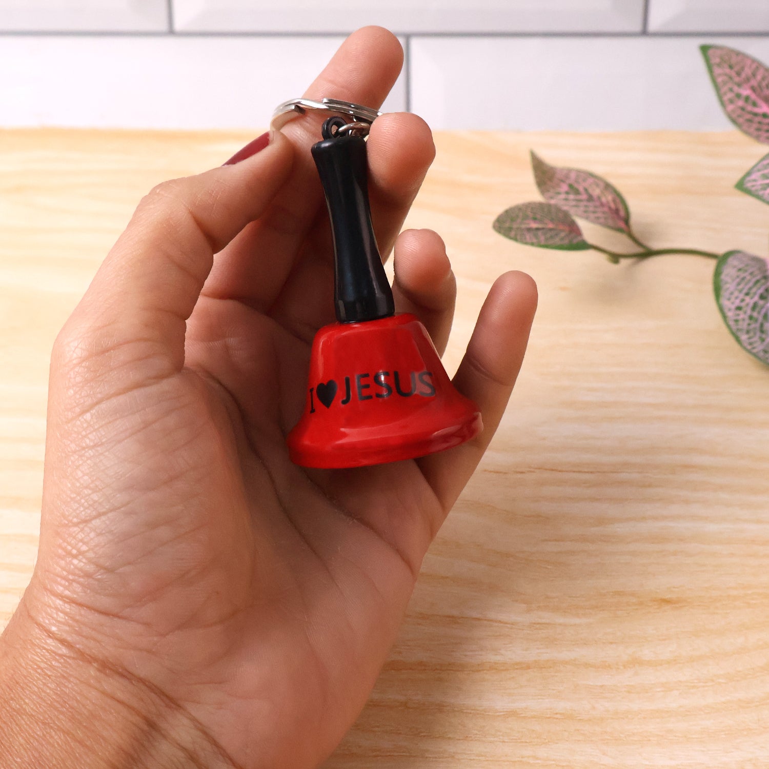 Wukusy mini hand bell with keychain, small portable brass bell attached to a keyring for easy use and decoration.