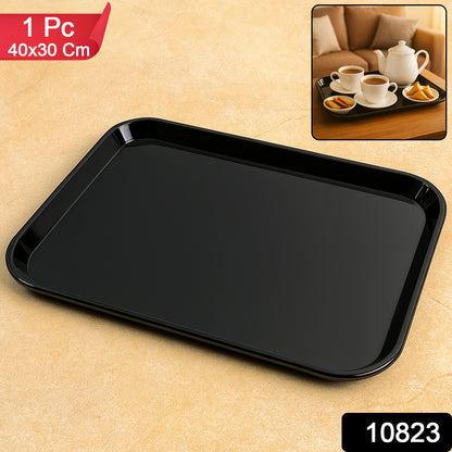 Black plastic serving tray plate, 40x30 cm, by Wukusy, shown with food and drinks for serving purposes.
