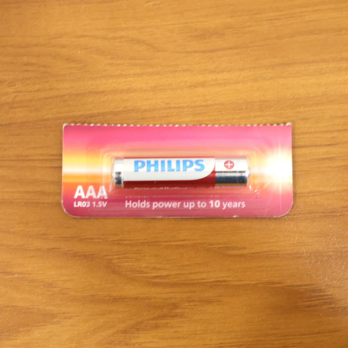 Wukusy AAA Ultra Alkaline Battery, single compact battery with positive and negative ends visible, for electronic devices
