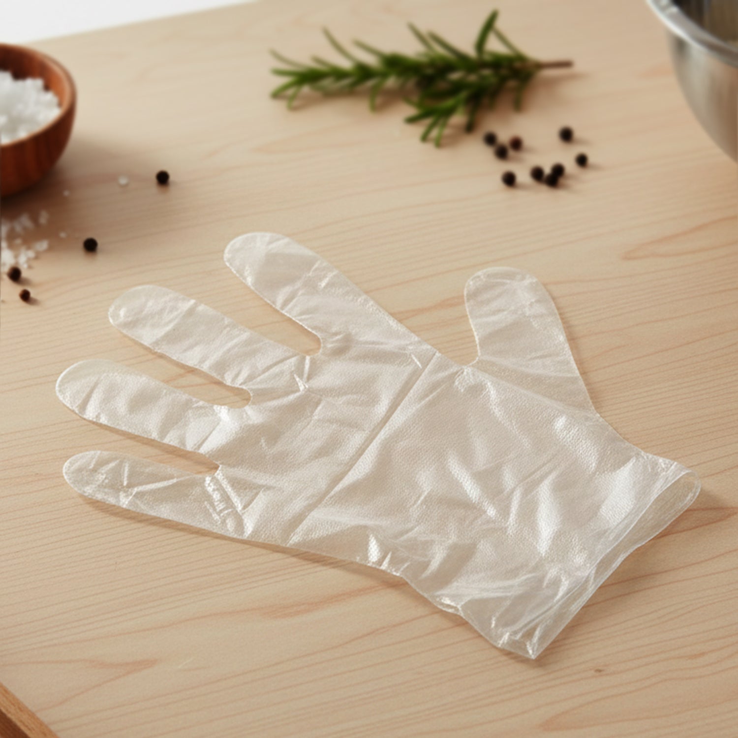 Disposable transparent plastic gloves by Wukusy, 100-pack, showing clear, flexible gloves suitable for hygiene and protection.