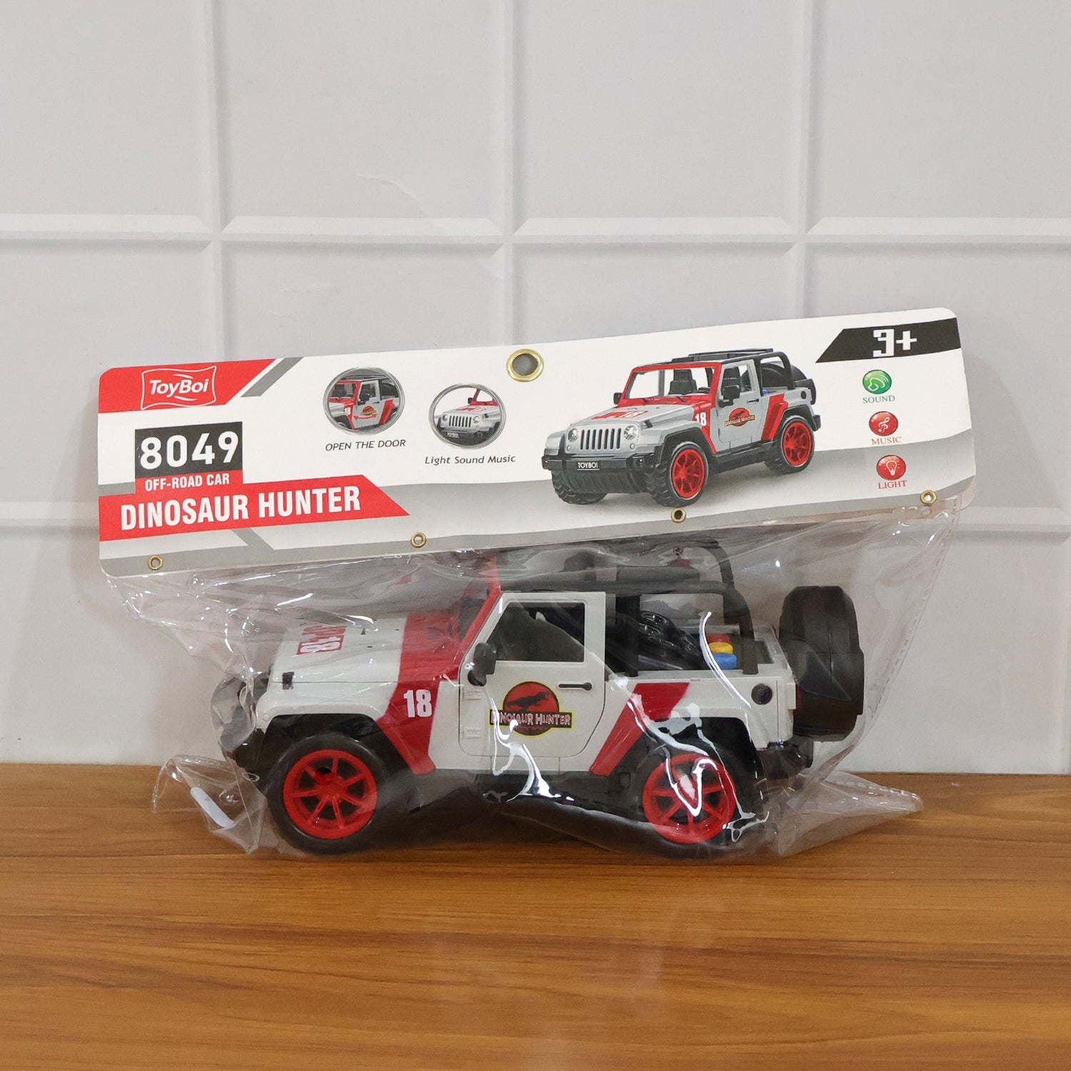 Kids dinosaur hunter off-road friction-powered toy jeep by Wukusy, featuring rugged design and dinosaur-themed decorations.