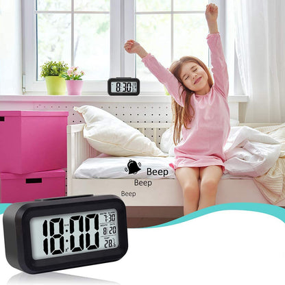Wukusy digital LCD alarm clock with backlight displaying time, placed on a bedside table for home improvement.