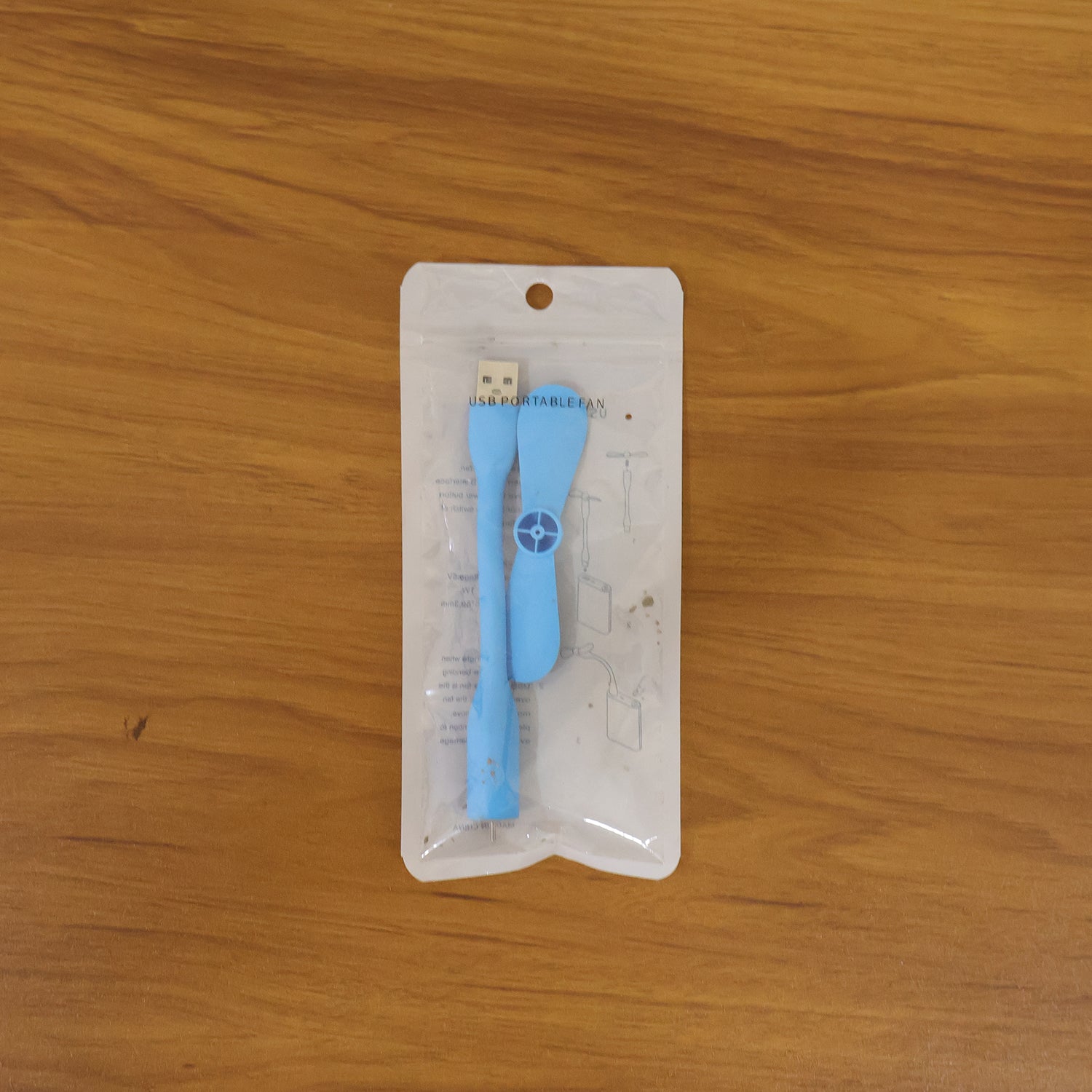 Wukusy portable USB mini flexible fan with adjustable blades for personal cooling, shown on a white background.