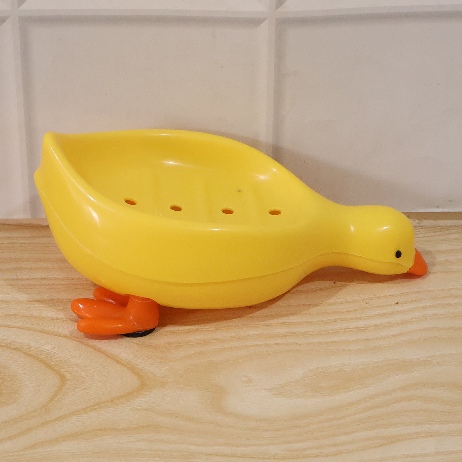 Cute duck-shaped plastic soap holder for bathroom, Wukusy kids soap dish tray with drainage slot, ideal for bathroom or kids' use.