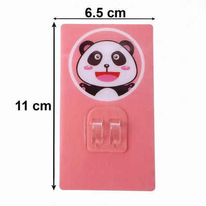 Wukusy cartoon adhesive plastic wall hook with strong hold, self-stick hanger for storage, shown on a wall in a home setting.