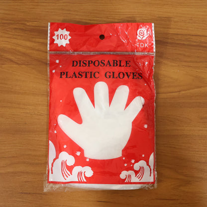 Disposable transparent plastic gloves from Wukusy, 100-piece pack, showing clear, flexible gloves suitable for various tasks.