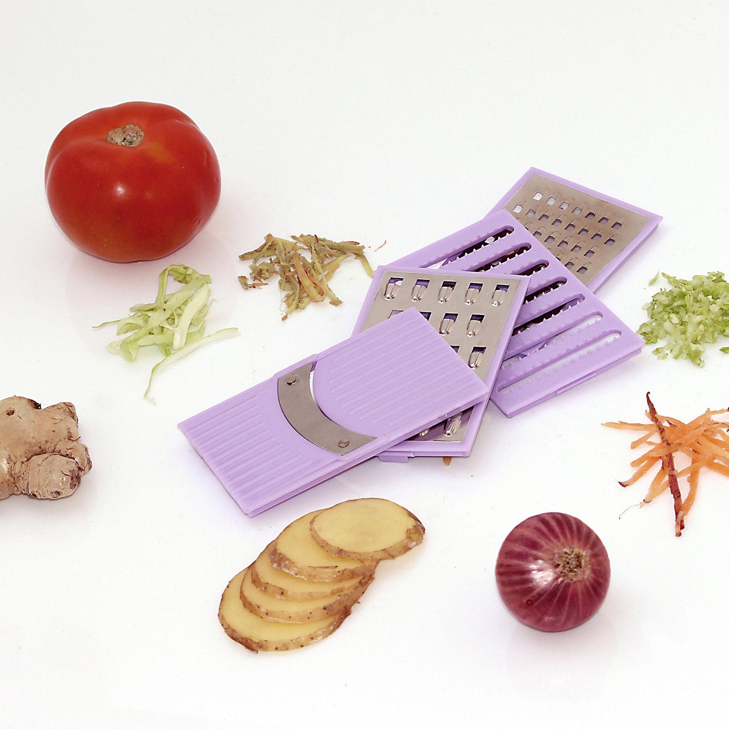 Wukusy 4-in-1 plastic vegetable and fruit grater and slicer with multiple blades for kitchen food prep.