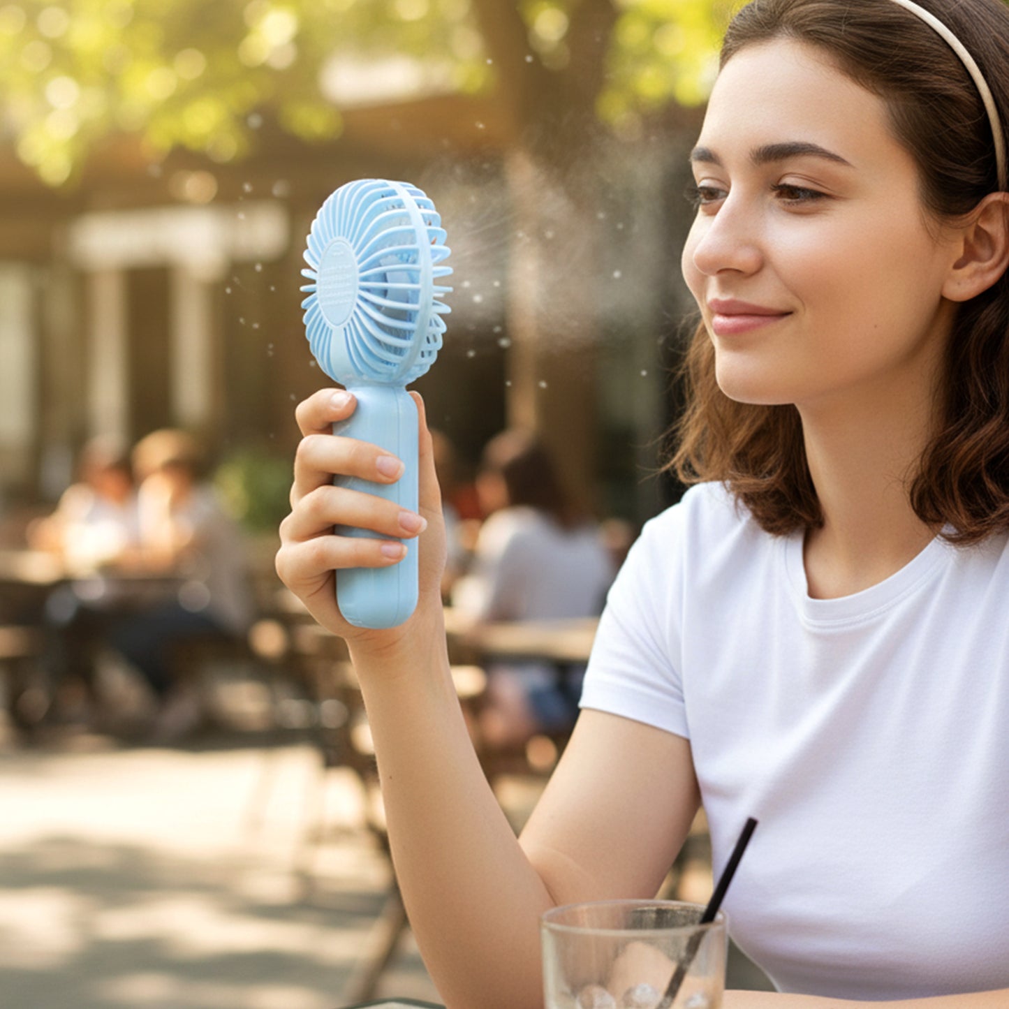 Wukusy portable mini handheld fan for personal cooling, compact design with adjustable settings, ideal for outdoor use