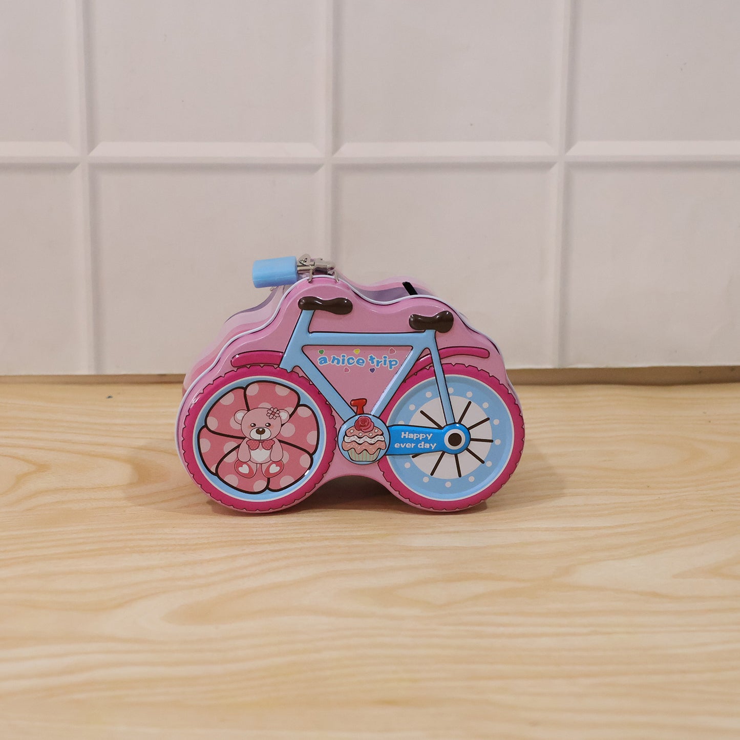 Wukusy bicycle-shaped piggy bank with lock and key, made of ceramic, featuring colorful bike design and coin slot on top.