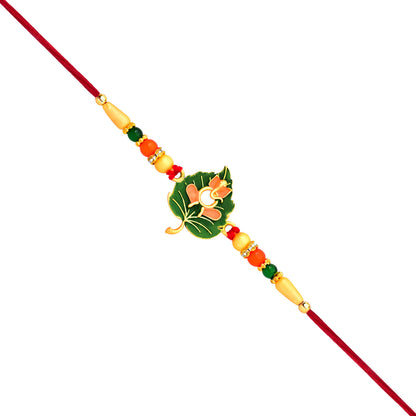 Green Tulsi leaf Rakhi with orange enamel flower and beaded thread, traditional fashion accessory by Wukusy