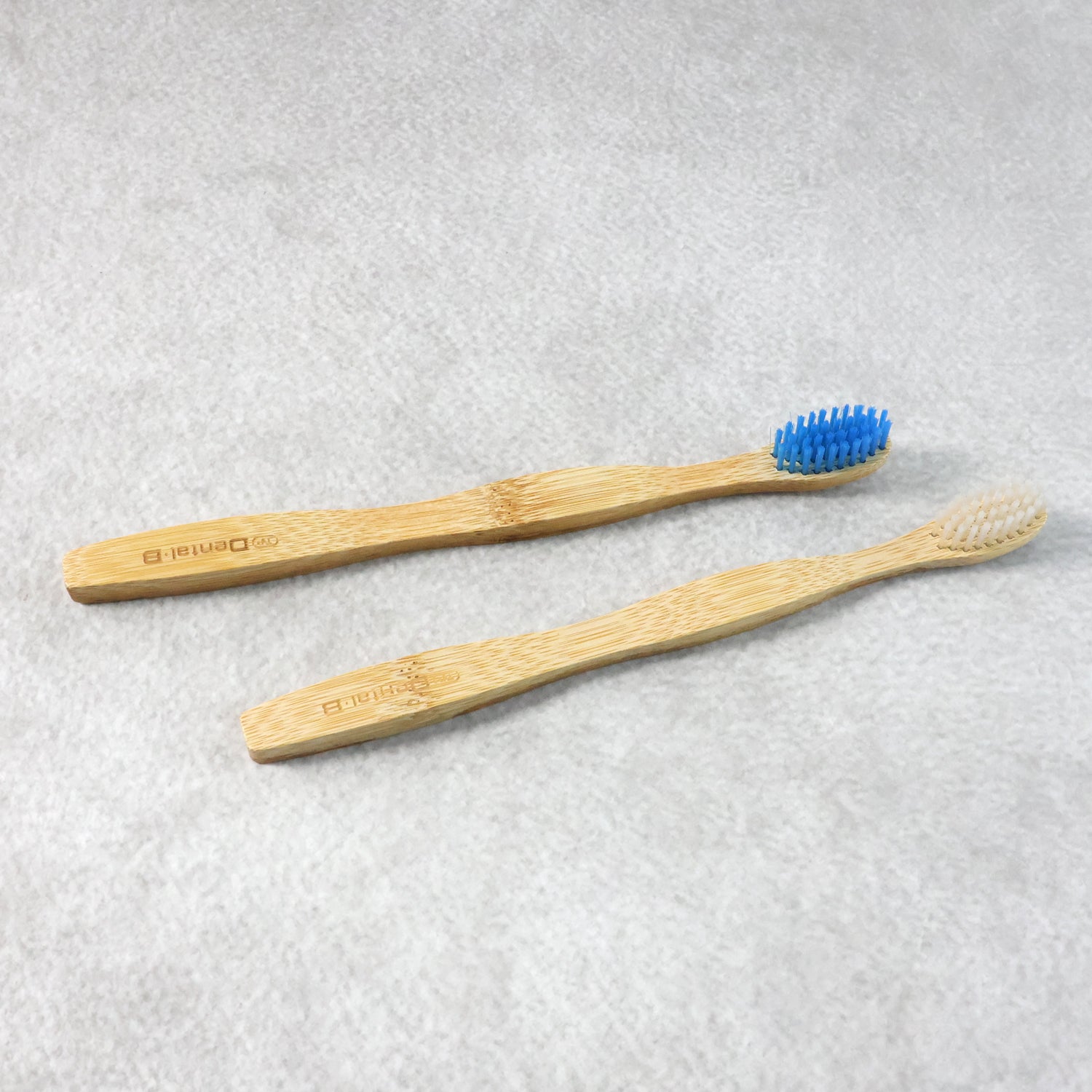 Wukusy eco-friendly bamboo toothbrush twin pack with 24 biodegradable toothbrushes, natural bamboo handles and soft bristles.