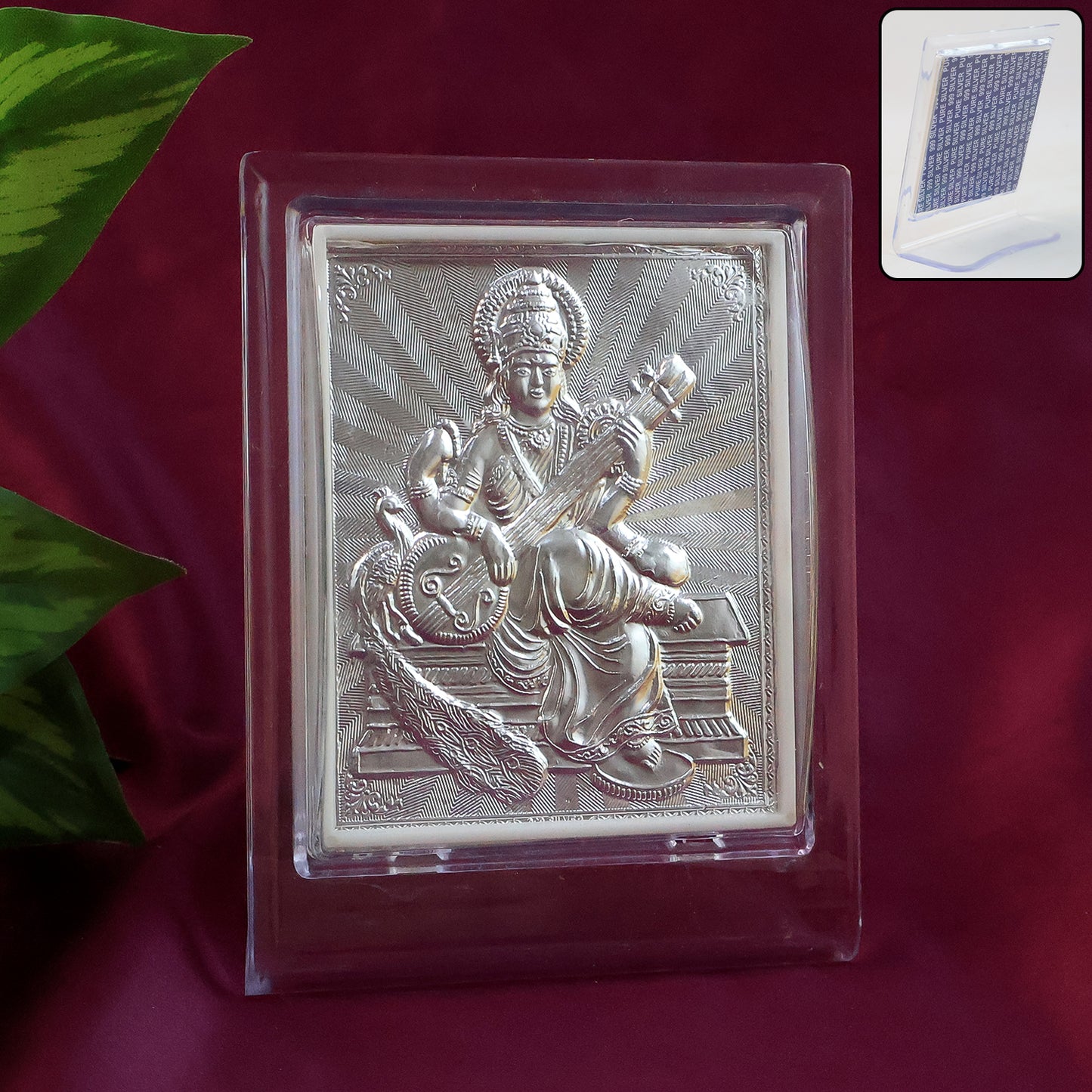 Elegant silver Saraswati Maa photo frame with stand for home decor, featuring intricate design and polished finish.