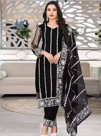 Womens kurta set with matching dupatta and bottomwear, featuring intricate embroidery and vibrant colors from brand 15801.