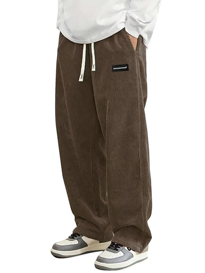 Boys corduroy casual pants with wide leg fit, elastic waist, and drawstring, featuring a loose and straight style for comfortable wear.