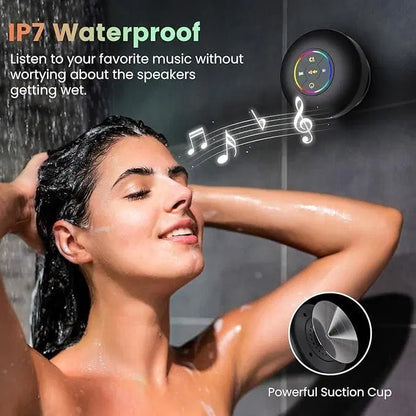 Large waterproof Bluetooth speaker with suction cup from 1238, shown with a sleek black design and hanging on a bathroom wall.