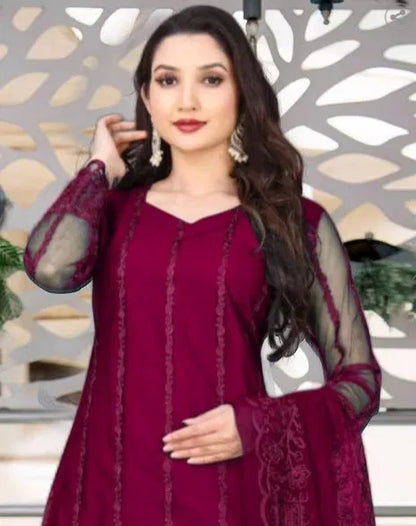 Women’s kurta set with matching dupatta and bottomwear, stylish and traditional, featuring intricate embroidery and vibrant colors.