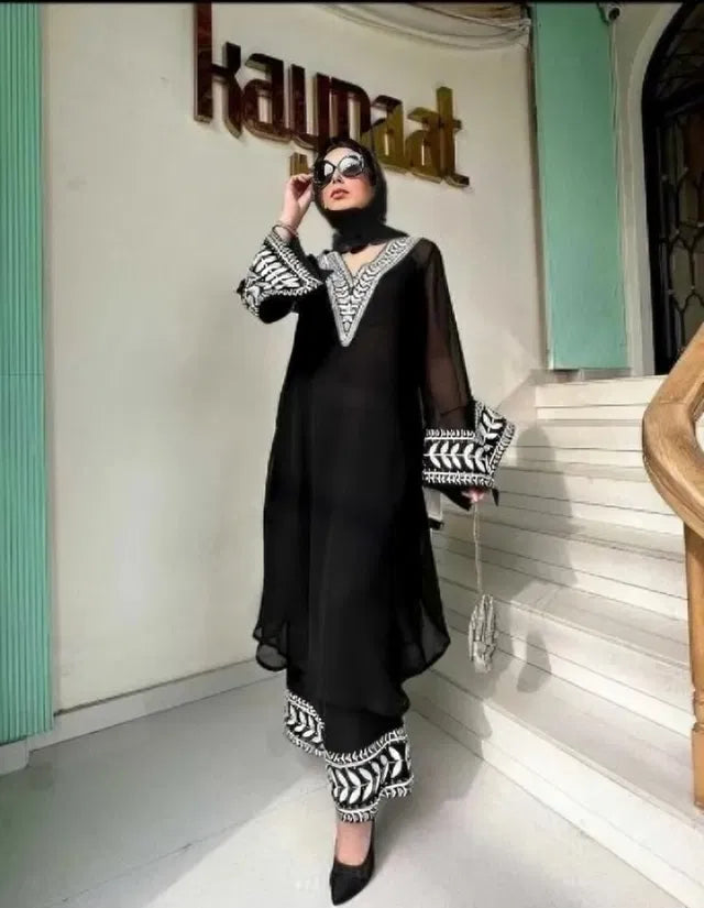 Women's kurta with matching bottomwear from 15801, traditional ethnic outfit, featuring vibrant fabric and intricate design.