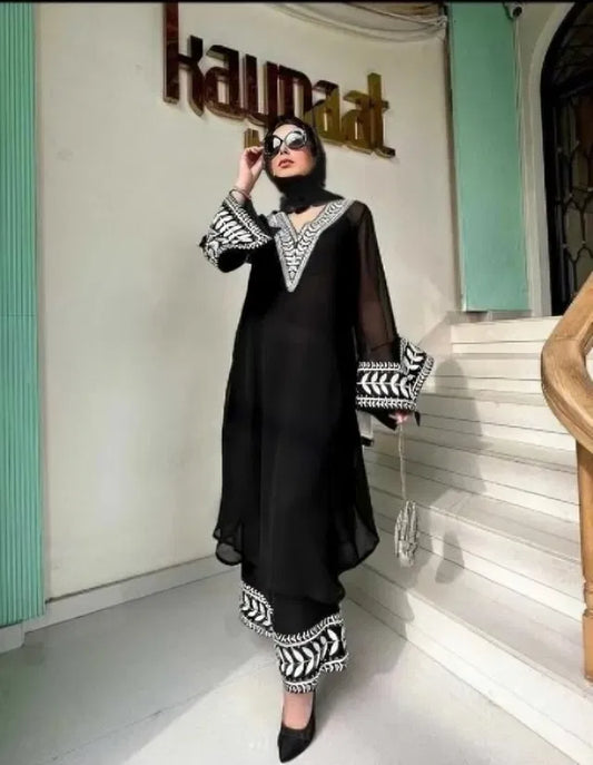 Women's kurta with matching bottomwear from 15801, traditional ethnic outfit, featuring vibrant fabric and intricate design.