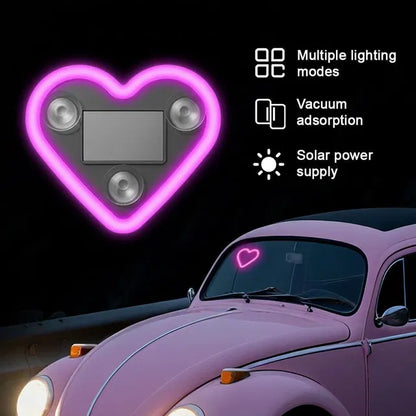 Heart-shaped car window light with suction cups, solar-powered cycle light and reflector from brand 34141, visible on car window.