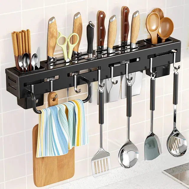 Wall-mounted magnetic knife holder and cutlery organizer by 31446, featuring metal slots for kitchen utensils and knives.