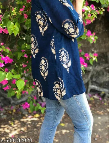 Trendy fashionable block print women's kurti with intricate design, casual wear from brand 13374, displayed on a hanger.